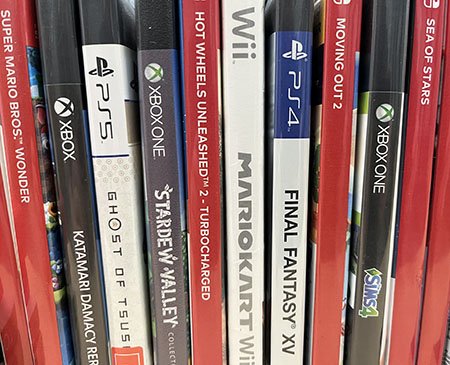 The spines of several video games stacked vertically together